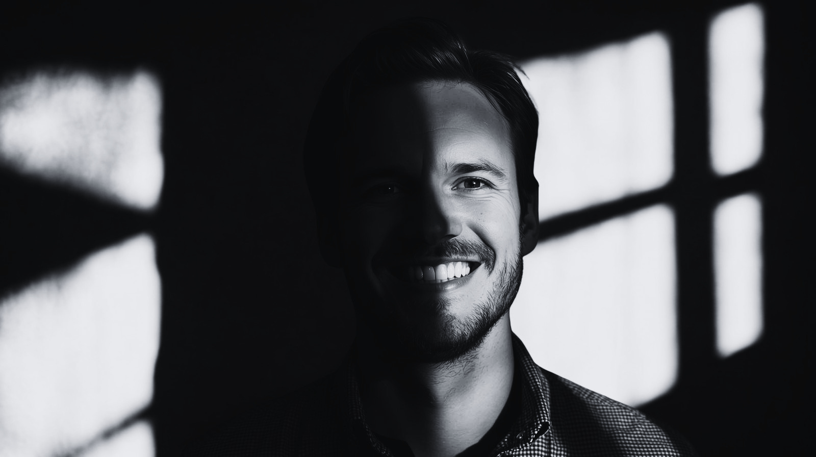 A man half in light and half in dark